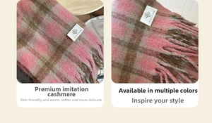 Detail of pink and brown plaid cashmere-like scarf with fringe and brand label