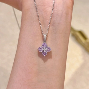 Elegant silver necklace with purple zircon flower pendant on neck for women