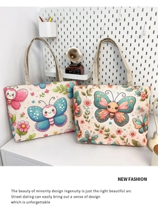 Close-up of ethnic print canvas tote bag with butterfly and floral patterns
