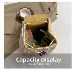 Top view of straw backpack showing large capacity for phone, umbrella and cosmetics