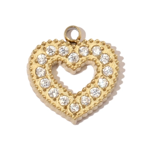 Detailed close-up of a heart-shaped gold pendant with pavé-set shimmering zircons