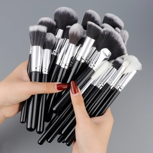 Professional 40-piece makeup brush set with soft synthetic bristles and sleek black handles