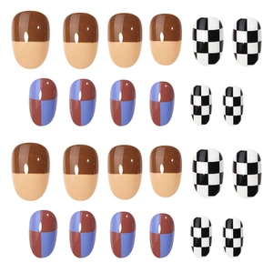 Short oval press-on nails with checkerboard pattern and warm-toned geometric designs