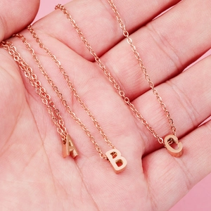 Handheld rose gold titanium steel necklaces with A, B, and C letter pendants