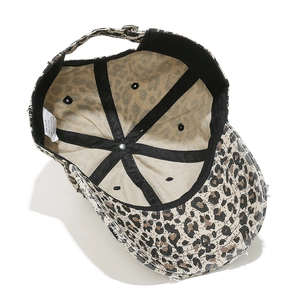 Internal view of leopard print baseball cap with sweatband and adjustable strap details