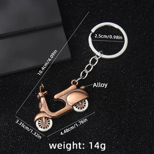 Vintage bronze alloy scooter motorcycle keychain with detailed size measurements