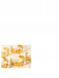 Detail of 18K gold-plated stainless steel cuff bracelets with nature-inspired motifs