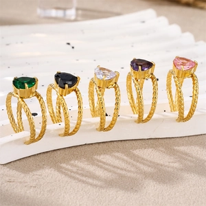 Detail of five-piece gold twisted rings with heart-shaped zircon stones in multi-colors