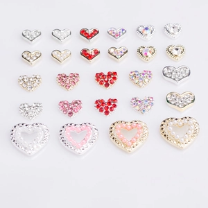 3D heart nail charms set with gold and silver alloy bases featuring pearls and rhinestones
