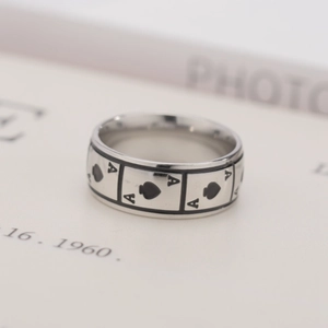 Detailed macro shot of a titanium steel ring with an engraved black Ace of Spades