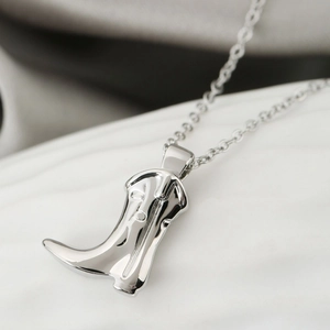 Polished silver cowboy boot pendant necklace for women with detailed engraving on O-chain
