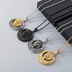 Detailed view of four hip hop lion head pendants in gold, silver, black and mixed finishes