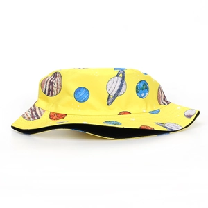 Detail of yellow bucket hat with space planet prints and reinforced stitching seams