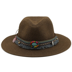 Detailed view of dark brown straw fedora with bohemian beaded band and turquoise accent