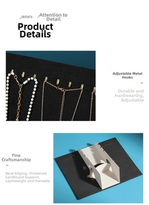 Detail view of portable jewelry display board with adjustable gold hooks and black velvet