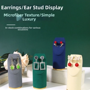 Detailed view of assorted fashion earrings displayed on premium microfiber jewelry stands
