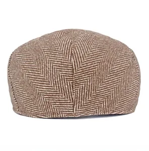 Rear view detail of men's wool blend herringbone newsboy cap showing back stitching