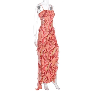 Detail of bohemian floral print dress with ruffle trim and side lace-up design