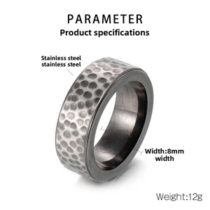 Detailed view of 8mm wide stainless steel ring featuring a hammered honeycomb texture