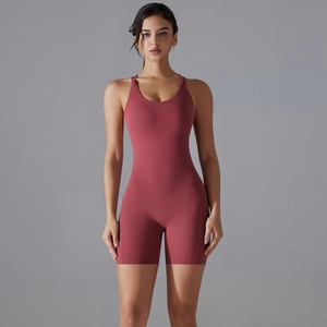 Detail of high-stretch yoga romper with backless design in matte dusty rose finish