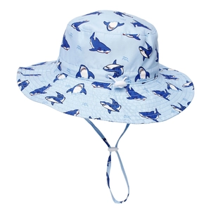 Detail of light blue sun hat for kids featuring shark prints and adjustable chin strap