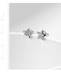 Macro shot of S925 sterling silver star earrings with half polished and half cubic zirconia
