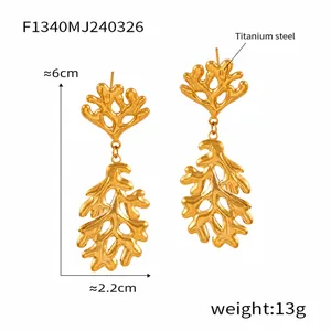 Detail view of gold titanium steel earrings with irregular branch design and dimensions