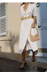 Detail of handmade beige woven handbag and matching wide belt with Mediterranean style