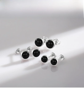 Macro detail of three pairs of S925 sterling silver black onyx bead stud earrings in 3 sizes