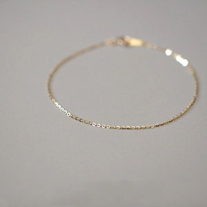 Macro detail of high-quality 14k gold plated sterling silver minimalist link bracelet