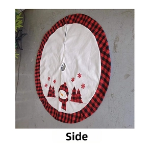 Detail of red and black buffalo plaid Christmas tree skirt with embroidered snowmen