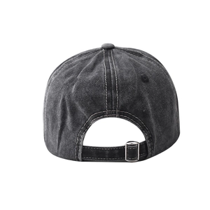 Detail of adjustable metal buckle and washed cotton texture on vintage baseball cap