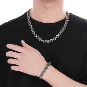 Men's punk vintage silver interlocking chain necklace and bracelet set on model