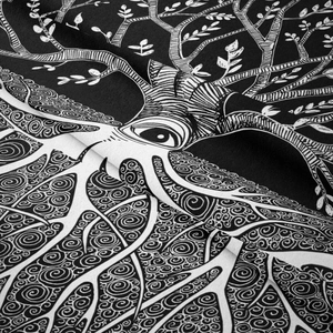Close-up of black and white tree of life tapestry showing fine woven fabric texture