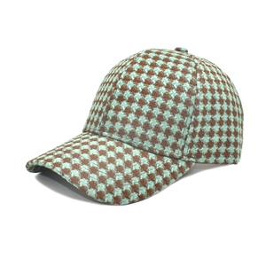 Stylish houndstooth knitted baseball cap in blue and brown with curved brim for outdoors