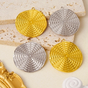 Close-up of gold and silver textured round 304 stainless steel pendants for DIY jewelry