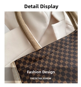 Macro detail of geometric patterned tote bag with beige woven handles and stitching