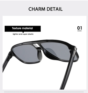 Detail of classic double-bridge pilot sunglasses showing light and elastic frame texture