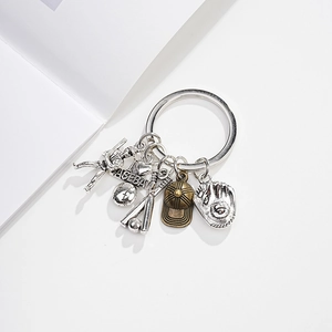 Detailed close-up of baseball themed metal keychain with glove bat and hat pendants