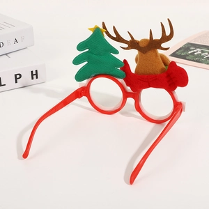 Christmas party eyewear with reindeer and tree ornaments on a clean white desk background