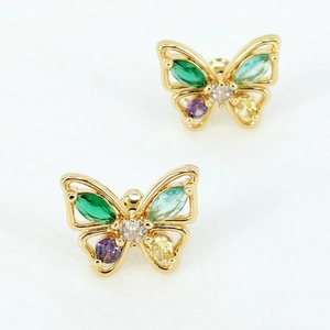 Macro shot of butterfly stud earrings featuring colorful zircons and golden plating