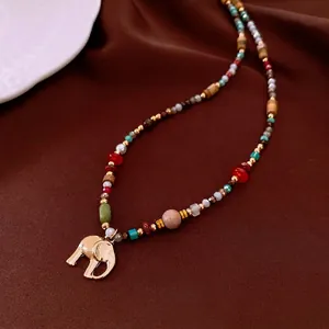 Vintage elephant charm beaded necklace with mixed wood, pearl and turquoise beads