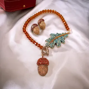 Vintage crystal leaf acorn necklace and earrings set with champagne rhinestones