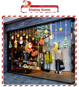 Christmas window decals with Santa and reindeer displayed on a modern shop glass window
