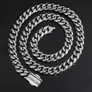Polished silver Cuban link necklace with a micro-pave zircon cross spring clasp detail