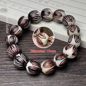 Macro detail of 15mm carved lotus bodhi seed beads on a handmade beaded bracelet