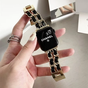 Elegant gold chain and black leather woven strap for Apple Watch with a luxury look