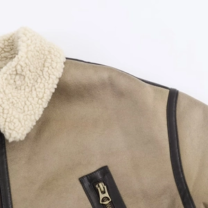 Detail of khaki leather jacket with white faux shearling collar and metal zipper