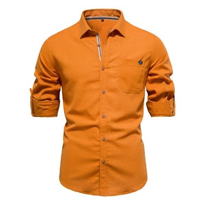 Detailed close-up of khaki cotton shirt collar with M size tag and firm texture fabric