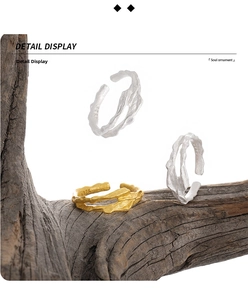 Detailed macro view of S925 sterling silver irregular wavy rings with textured gold finish